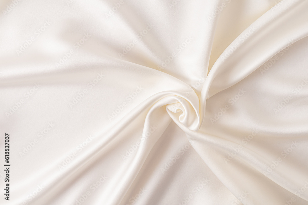 Beautiful delicate beige satin background with soft pleats for wedding or festive design.