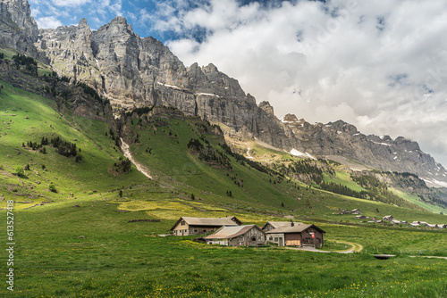 Alpine huts and barns on Urnerboden, the largest alp in Switzerland at the foot of the Glarus Alps near Klausenpass, Spiringen, Canton Uri, Switzerland photo