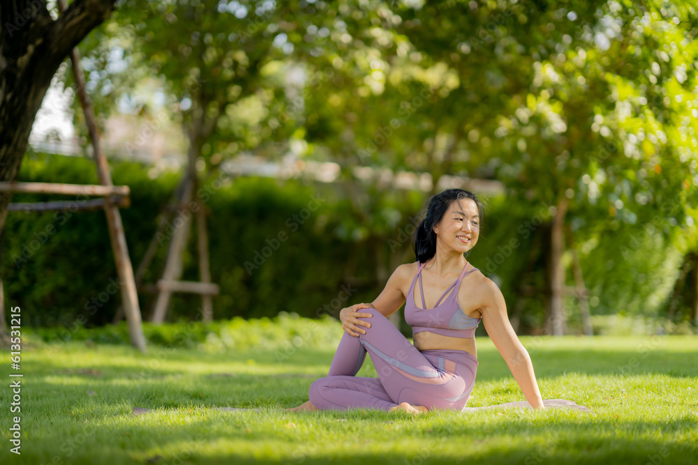 Asian woman wearing yoga clothes doing yoga at her village garden in the morning, happily, Sports healthy lifestyle concepts, Japanese concepts. Asian woman wearing yoga clothes doing yoga at her village garden in the morning, happily, Sports healthy lifestyle concepts, Japanese concepts.