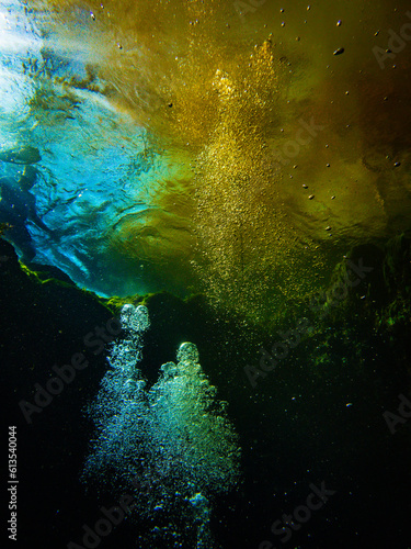 Waters mixing as blue spring water hits murky orange river water at Devil s Ear  Ginnie Springs  Florida