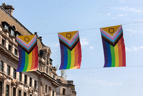 Pride rainbow flags over Regent Street in London supporting diversity and inclusivity.