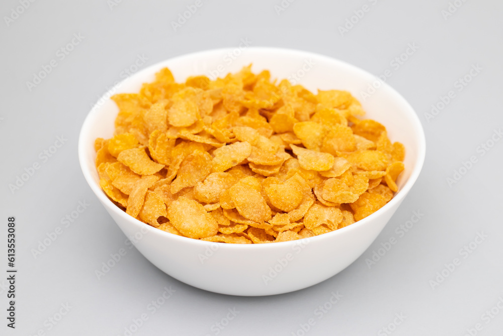 few corn flakes in white big bowl few corn flakes in white big bowl