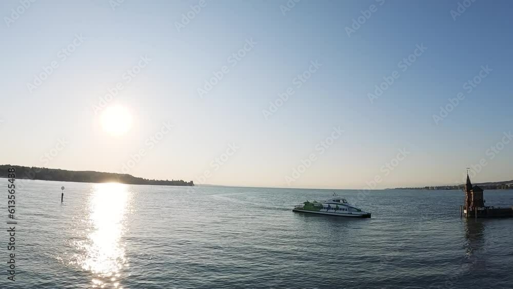 Luftaufnahme auf dem Bodensee mit der Katamaran Fähre welche den Konstanzer Hafeneingang bei Sonnenaufgang erreicht. Bodensee, Konstanz, Baden-Württemberg, Deutschland, Europa. Luftaufnahme auf dem Bodensee mit der Katamaran Fähre welche den Konstanzer Hafeneingang bei Sonnenaufgang erreicht. Bodensee, Konstanz, Baden-Württemberg, Deutschland, Europa.