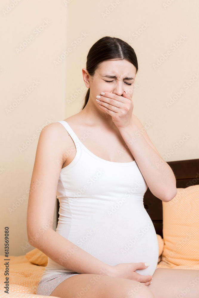 Pregnant suffering with nausea. Pregnancy symptoms, expectation