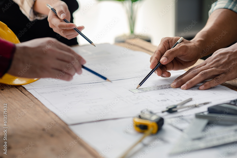 The home design architects are reviewing the house plan draft, the project commissioned by the client, and the custom design before delivery. Interior design and decoration ideas. The home design architects are reviewing the house plan draft, the project commissioned by the client, and the custom design before delivery. Interior design and decoration ideas.