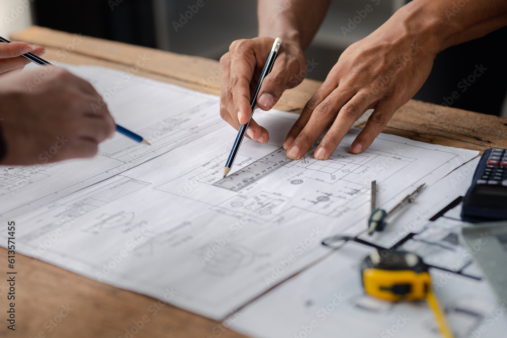The home design architects are reviewing the house plan draft, the project commissioned by the client, and the custom design before delivery. Interior design and decoration ideas. The home design architects are reviewing the house plan draft, the project commissioned by the client, and the custom design before delivery. Interior design and decoration ideas.