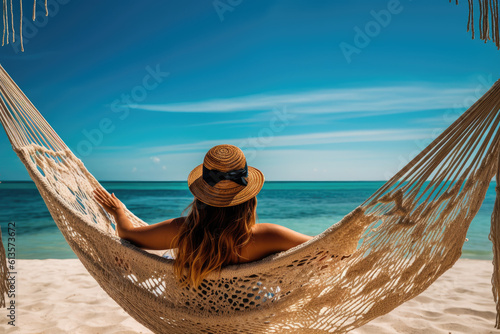 view from behind woman wearing sun hat relaxing in hammock on tropical beach. Generative ai