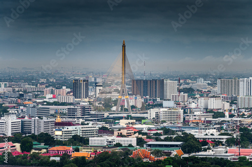 Suspension Rama 8 Bridge with financial building and temple in downtown © Mumemories