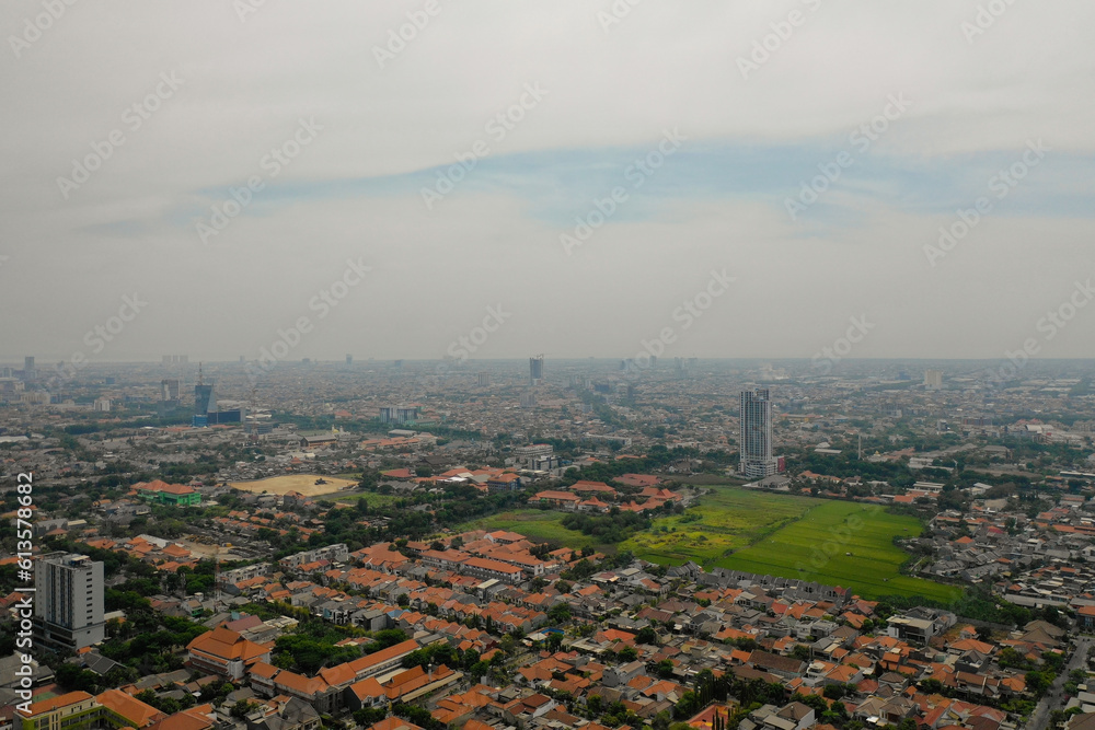 Aerial cityscape modern city Surabaya with skyscrapers, buildings and houses. city skyline with skyscrapers and business centers Surabaya capital city east java, indonesia