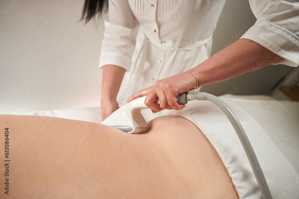 Female gives a client a hardware back massage Female gives a client a hardware back massage