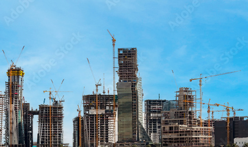 Riyadh, Saudi Arabia, KSA - June 18, 2013 buildings being constructed in the new King Abdullah Financial District in Riyadh with cloudy sky