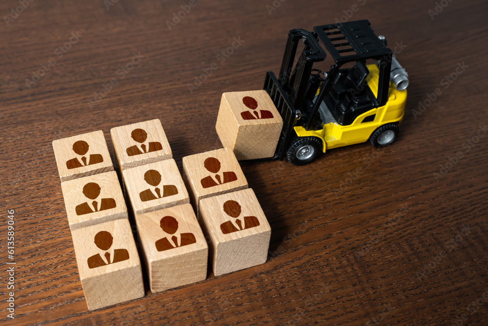 Fototapeta premium Forklift builds a team of people. Recruitment seeking to fill job openings Putting people in their places. Opening of new jobs. Attract investors who provide financial support. Humanitarian missions