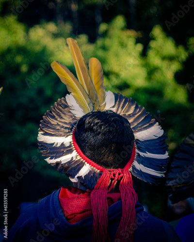 Sao Paulo, SP, Brazil - November 15 2021: Indian woman with colorful feather headdress details.