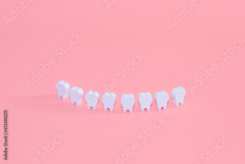 Healthy white teeth, tooth protection from tooth decay, gums with teeth, smiling tooth, character for dentistry. Dental concept banner with copy space. Children's toy doctor