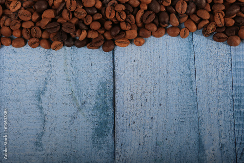coffee beans on wood background © Арман Амбарцумян