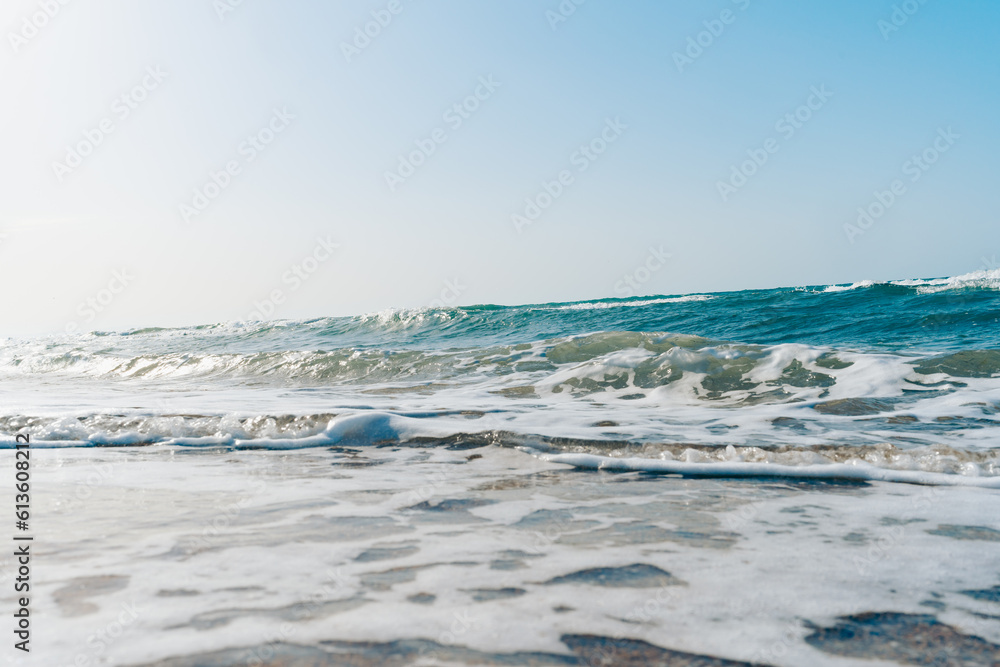 Seascape or ocean coast. Waves on the sand. Summer vacation travel concept Seascape or ocean coast. Waves on the sand. Summer vacation travel concept
