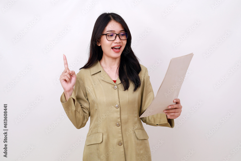 Excited Young pretty teacher getting idea while holding paper Excited Young pretty teacher getting idea while holding paper