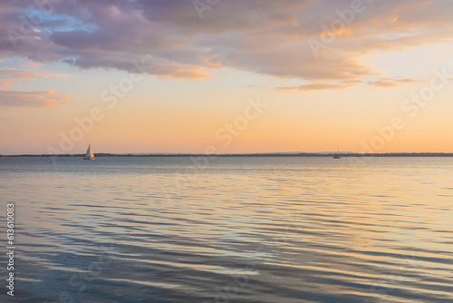 Sunset at Lake Balaton in Hungary, Calm water surface, pretty clouds, Concept, Holiday landscape © Rochu_2008
