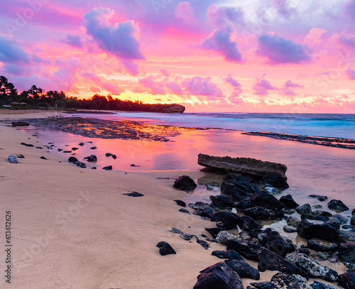 Cloud Filled Sunrise Reflecting on Tide Pools., Shipwreck Beach, Kauai, Hawaii, USA photo