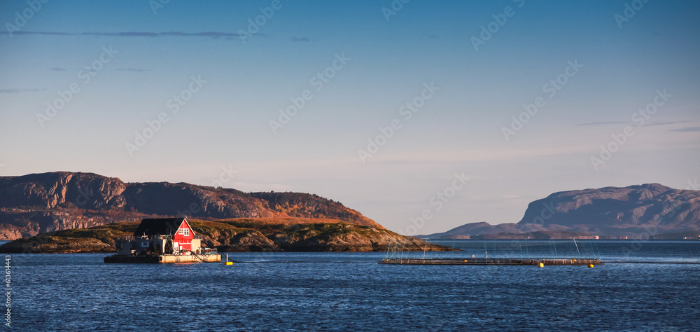 Fototapeta premium Floating Norwegian fish farm for salmon growing