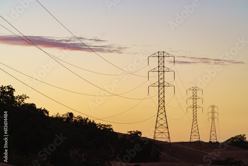 Electrical transmission lines going into the distance at dusk