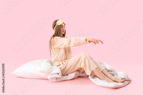 Young woman in pajamas with...