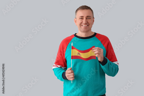 Mature man with flag of Spa...