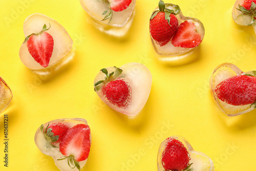 Fototapeta Naklejka Na Ścianę i Meble -  Fresh strawberry frozen in ice on yellow background