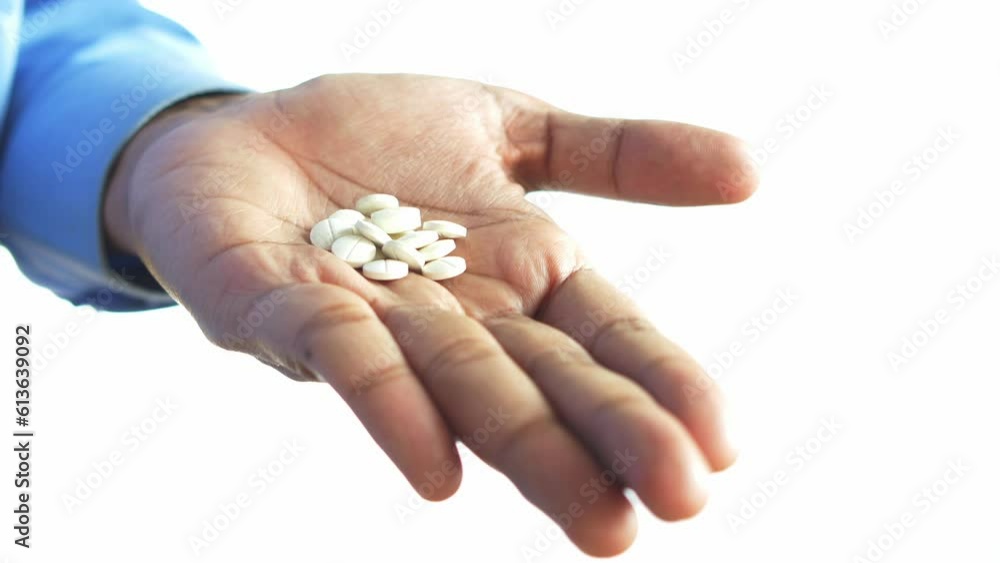 young men taking medical pill isolated on white young men taking medical pill isolated on white