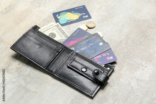 Black wallet with money, cr...
