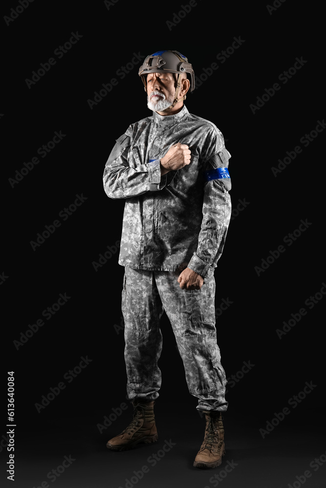 Ukrainian soldier on dark background Ukrainian soldier on dark background