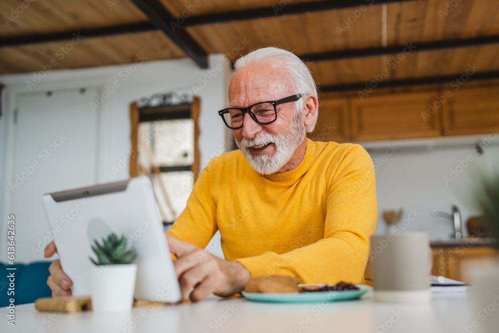 Senior caucasian man use digital tablet to make a video call at home Senior caucasian man use digital tablet to make a video call at home