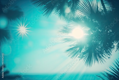 Abstract blurred defocused backdrop, toned softly blue, nature of tropical summer, sun beams. Beautiful palm trees and sunrays against the sky and water. Idea for a summer vacation, copy space