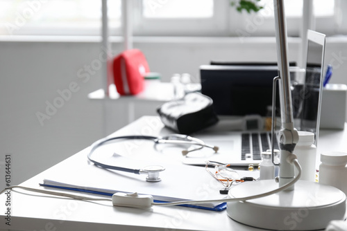 Doctor s workplace with medical supplies in office  closeup