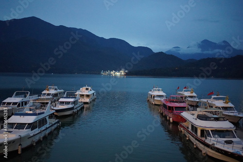 boat on lake in dusk, sun moon lake taiwan © ac