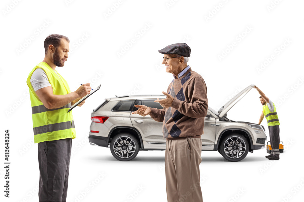 Elderly man talking about a car problem with a road assistance worker