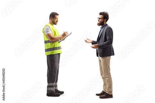 Full length shot of a bearded man talking to a worker in a reflective vest