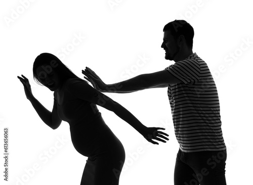 Silhouette of man beating his pregnant wife on white background. Domestic violence concept