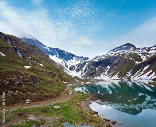Alps mountains tranquil summer view (reflections on the lake  near Grossglockner High Alpine Road) © wildman