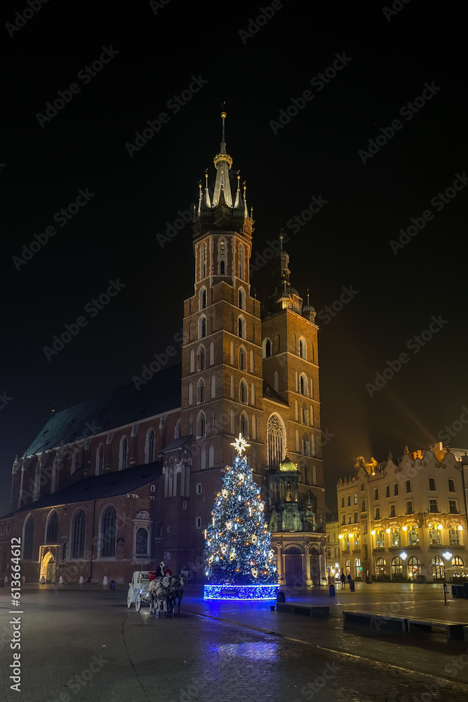 Basilica of Saint Mary in Krakow, Poland at night in winter.
