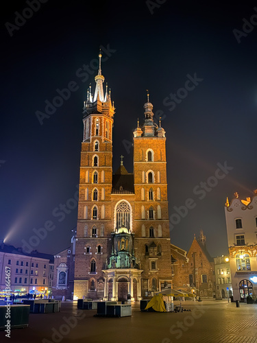 Basilica of Saint Mary in Krakow, Poland at night in winter.