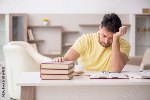 Young male student studying at home