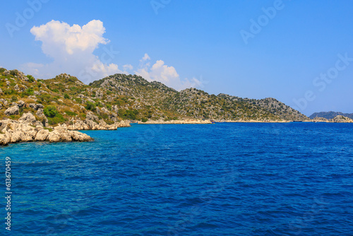 View of the rocky shore from the sea. Mediterranean Sea in Turkey. Popular tourist places. Background