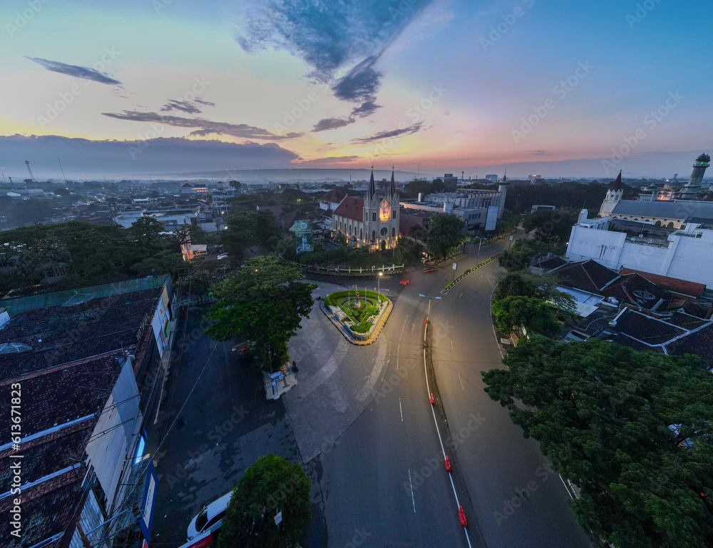 the view of the sunrise at the wooden hand church in malang