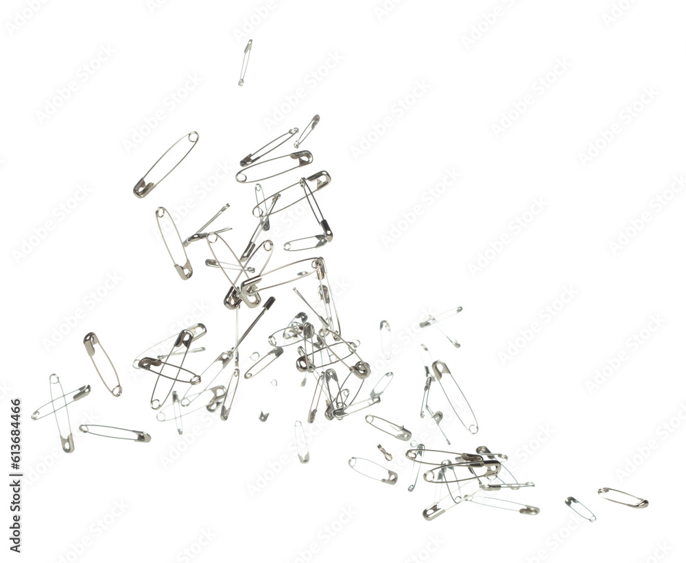 Fototapeta premium Safety Pin brooch pour fall down, explosion in air. Many safety pin small size splash fly in group floating. White background isolated high speed shutter freeze motion