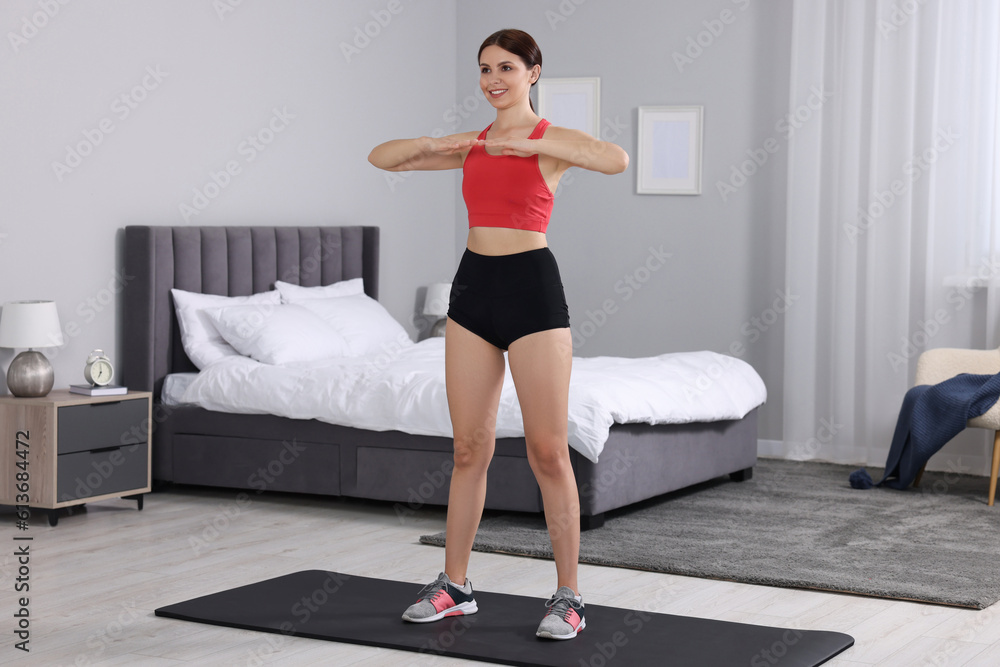 Happy woman doing morning exercise at home Happy woman doing morning exercise at home