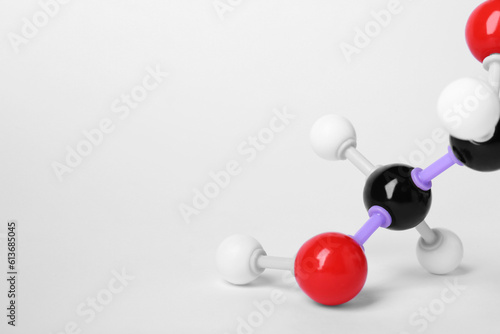 Molecule of vitamin C on white background, closeup. Chemical model
