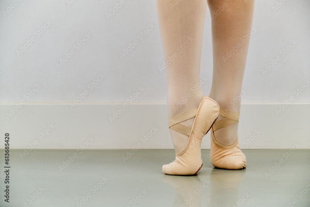 Close up of ballerina legs in ballet shoes. Close up of ballerina legs in ballet shoes.