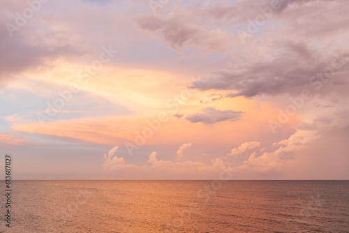 Beautiful sunset on the ocean. Beautiful landscape at sunset, pink and orange sky, beach. Background for summer holidays. Spectacular sunset sky in Florida