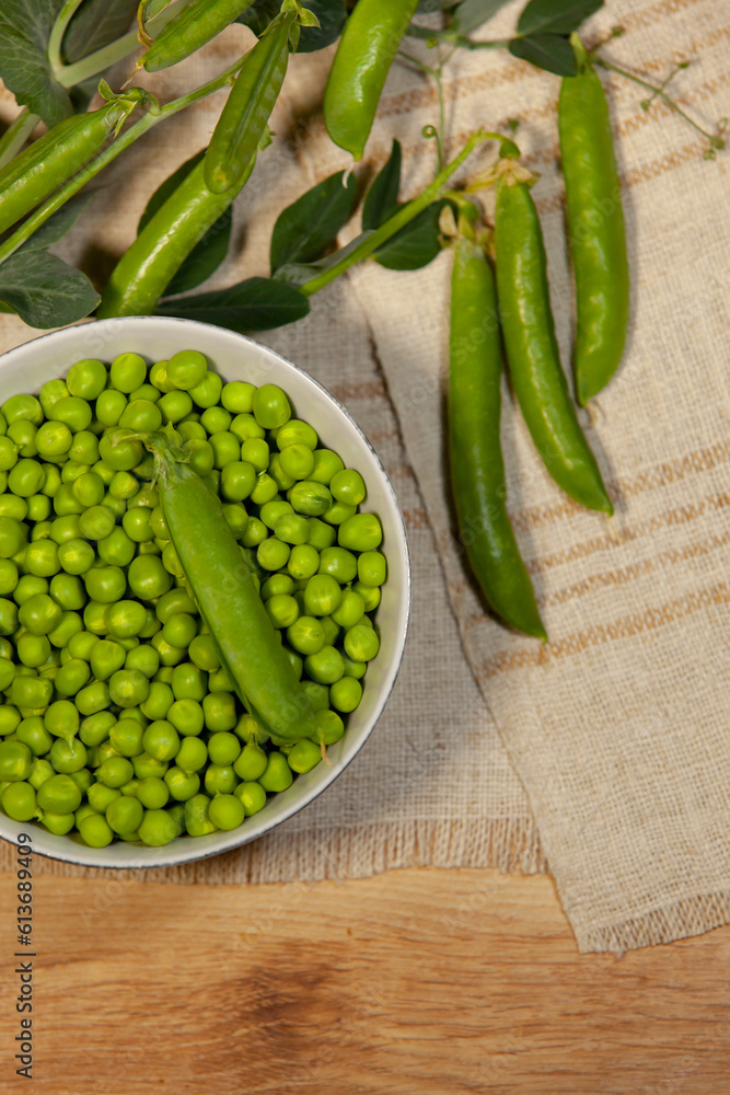 Juicy green peas in pods and grains. Close-up.